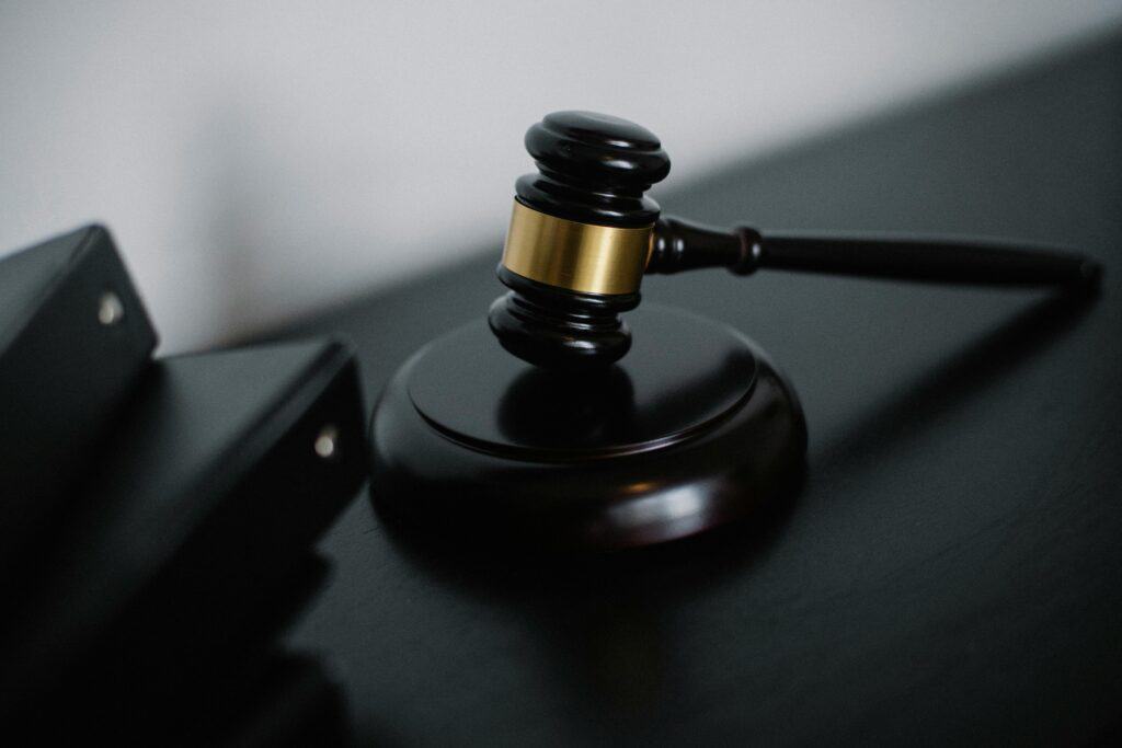 property auction Close-up of a wooden gavel on a desk, symbolizing justice and legal authority.